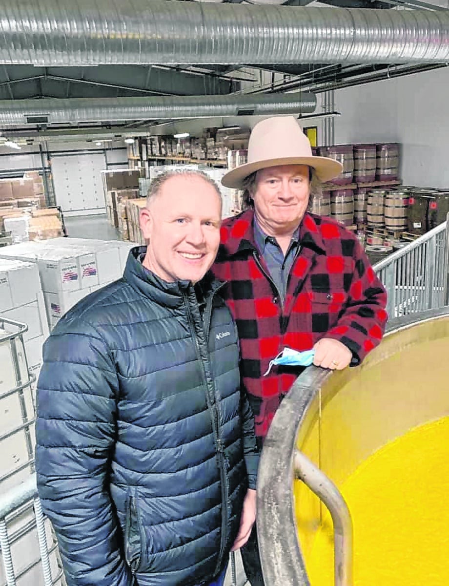 State Rep. Chris May (R-Bedford) (left) tours Hard Truth Distilling Co. in Nashville with Jeff McCabe (right), one of the owners, on Friday, Jan. 22, 2021. May is working with McCabe on legislation to bring greater awareness to Indiana rye whiskey, one of the spirits distilled at Hard Truth, and help establish a market in the state similar to what Kentucky has with its bourbon.