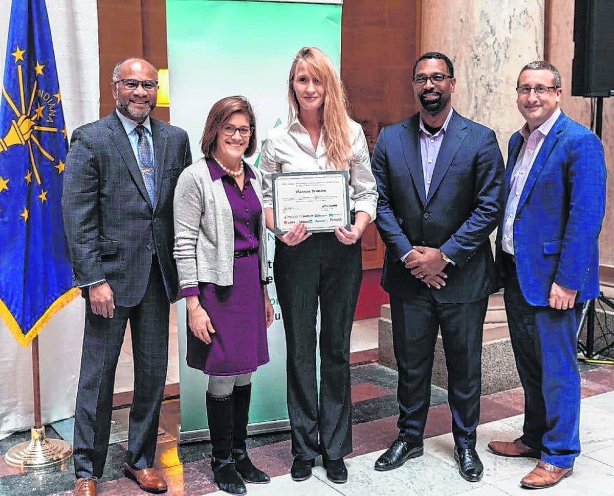 Shannon Brunton, center, the Career Resource Center of Brown County graduation and career coach, poses with dignitaries at the Indiana Statehouse (from left: Executive Director of Skillful William Turner, CEO of Skillful Beth Cobert, Brunton, Department of Workforce Development Commissioner Frederick D. Payne, and Director of Career Pathways at Microsoft Joshua Winter). Brunton recently completed training through the first Skillful Governor's Coaching Corps. She presented her findings and made recommendations to the Brown County school board in December. Submitted