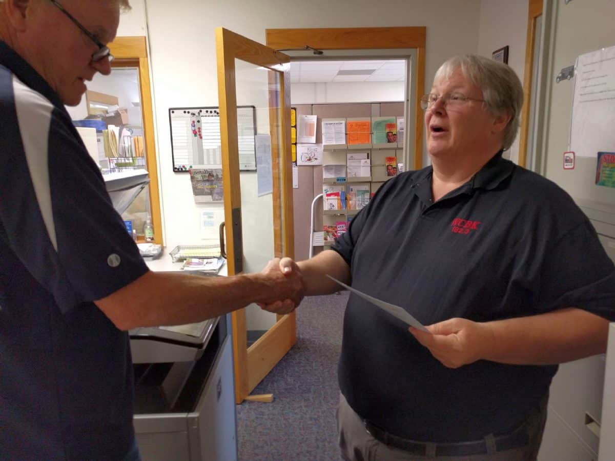Little Nashville Opry owner Scott Wayman, right, receives his local wastewater permit at the Brown County Health Department from John Kennard, left, in August 2016. Wayman passed away this year and the Little Nashville Opry property is back on the market.  Brown County Democrat file photo