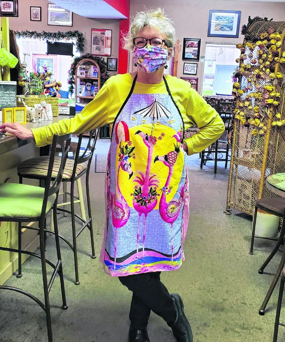 The "coffee shop gang" at Common Grounds hasn't been able to get together anymore in this era of social distancing, so they've been keeping each other company virtually through a "long thread of texts," said "gang" member Joan Rigley. This photo of shop owner Iris Gearhart in flamboyant flamingo attire was part of it. "She has tried so hard to continue to take are of us, and us the same back," Rigley wrote.  Submitted photo