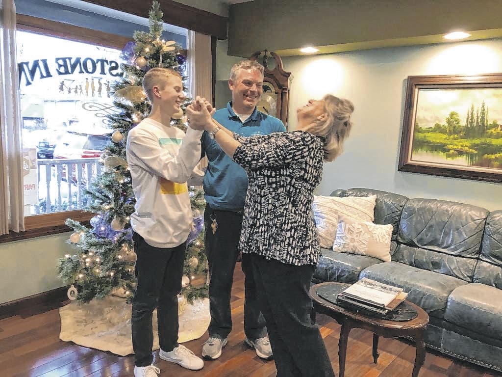Brown County High School senior Chase Watson celebrates with his parents, Lauri and Chad Krtizer, at the Cornerstone Inn after he told them he had been named the 2019 Lilly Endowment Community Scholar. This meant his undergraduate college bills would be paid for.