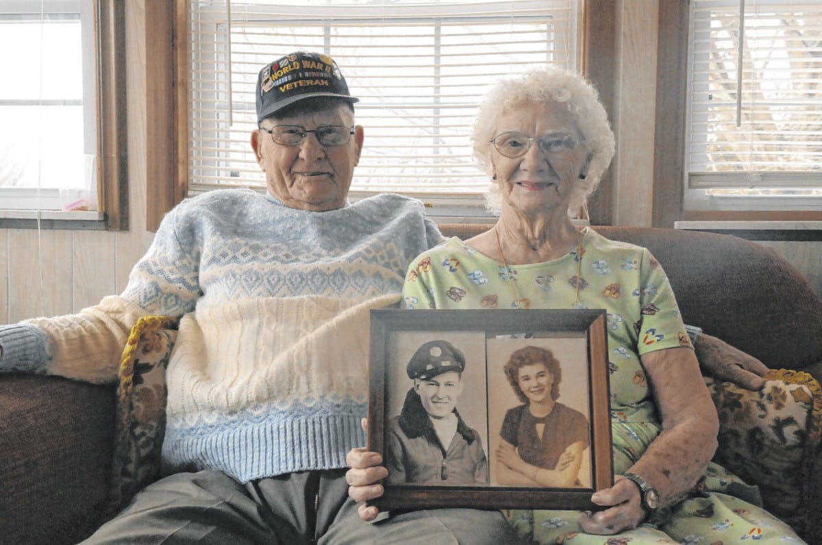 Bob and Delores Gipson pose with photos of themselves from around the time they met. The couple celebrated their 70th wedding anniversary on March 5. “We pretty much agree on most everything, most of the time,” Delores said, as he silently smiled beside her — “until he wants to do something dumb. He gets some dumb ideas once in awhile.”