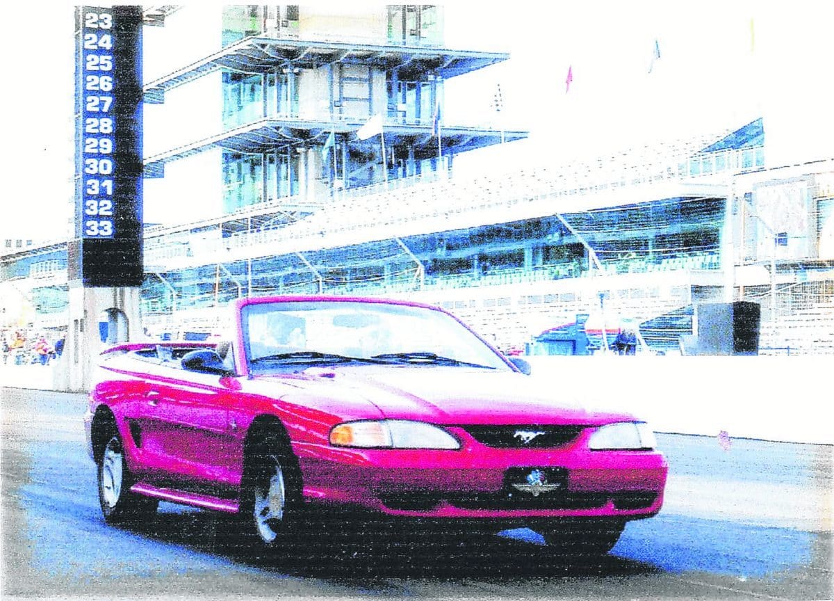 Larry Hanson pilots his red Mustang convertible over the Indianapolis Motor Speedway’s Yard of Bricks somewhere around 130 miles per hour around 2005. Submitted photo