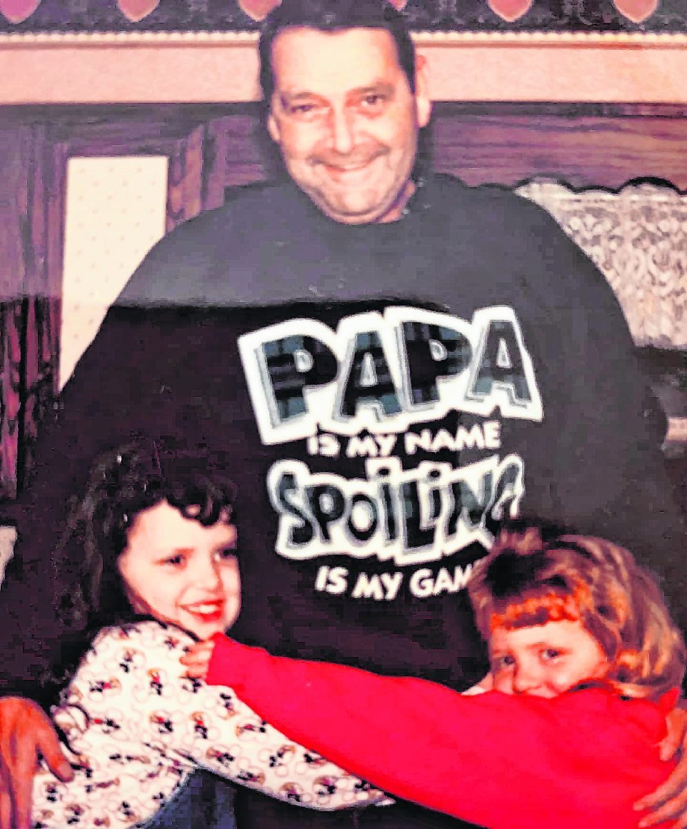 Russell Kelso stands with his two granddaughters, Suzannah and Eliza, wearing his “Papa is my name. Spoiling is my game” sweatshirt. Spoiling his grandchildren was one of his favorite past times. He showed them what true unconditional love was. Kelso was a lifetime resident of Brown County. He passed away in February. Submitted photo