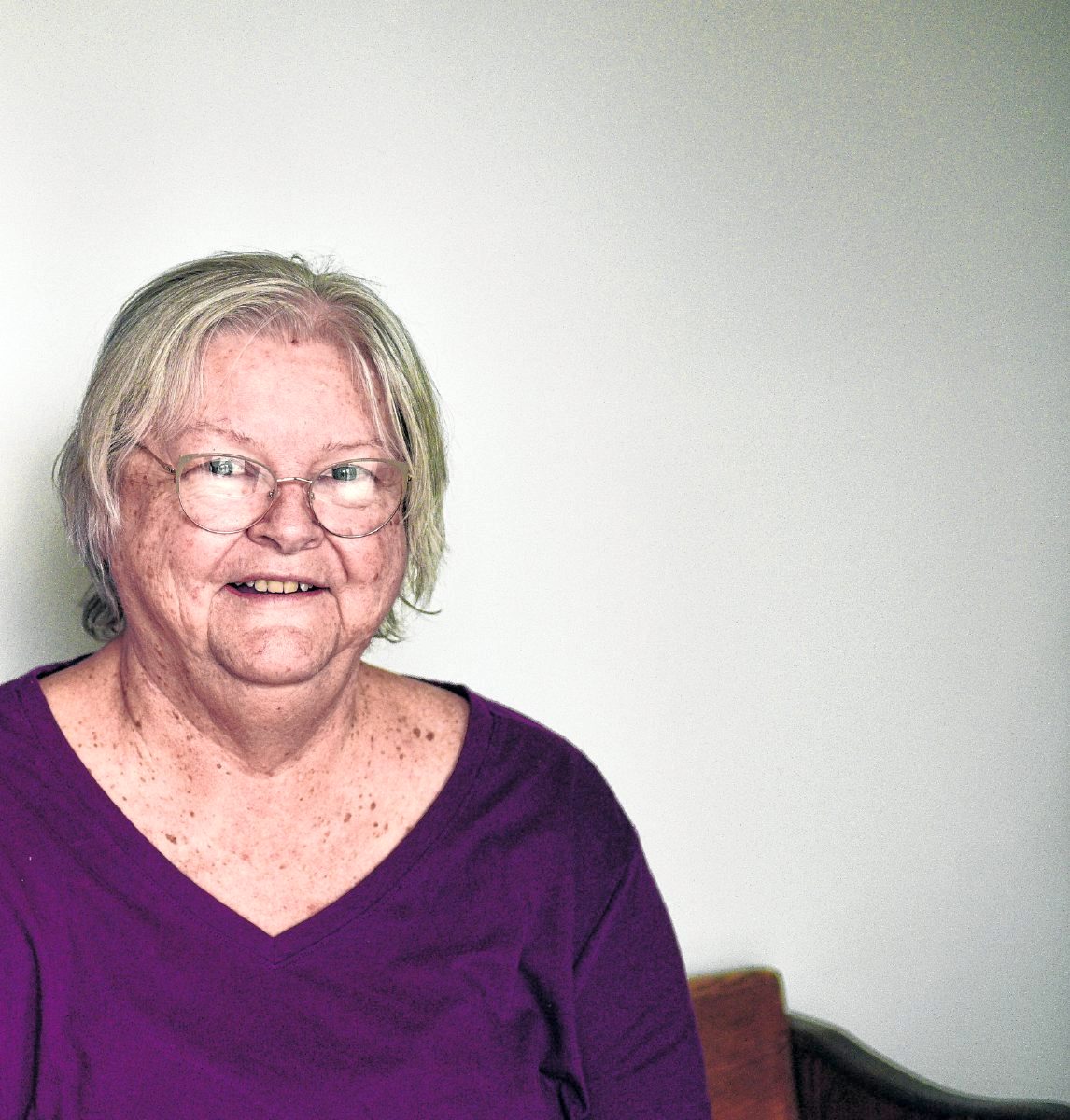 Stephanie Kritzer smiles for the camera. Kritzer lives alone and said the last year in the pandemic was challenging as she felt isolated from her loved ones while staying home. Kritzer is retired and serves on the Brown County School Board of Trustees. Abigail Youmans | The Democrat